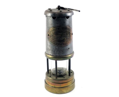 A British Coal Mining Company mining lamp, serial number 88656, 22cm high. 