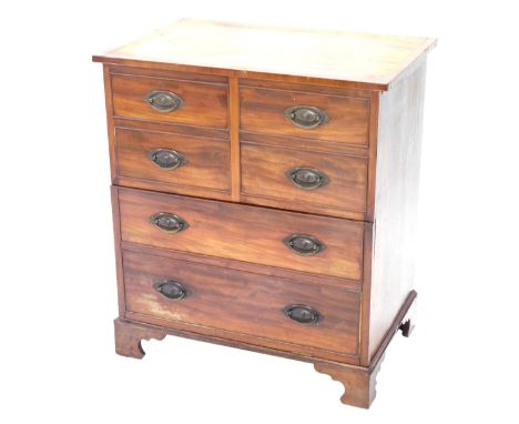 A George III mahogany commode, the hinged cross banded ebony and boxwood strung lid enclosing a recess with arm supports abov