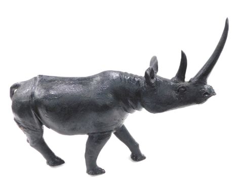 A large African carved stone model of a rhino, 74cm long. 