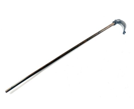 An early 20thC bamboo walking stick, with silver inlaid decoration, the chase handle decorated as a dolphin with green perido