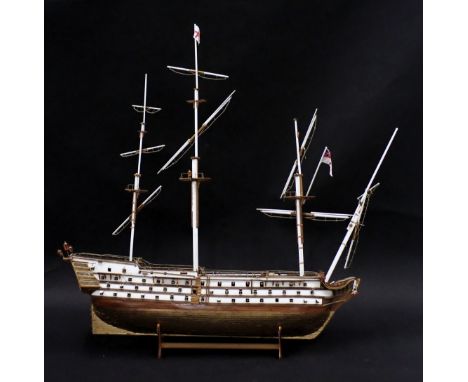 A scale model of HMS Victory, with three masts, various fitted cannon, part gilt metal hull, etc., 102cm long.