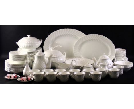 A Wedgwood white fluted part dinner and tea service, to include tureens, oval meat dishes, teapot, coffee pot, etc. 