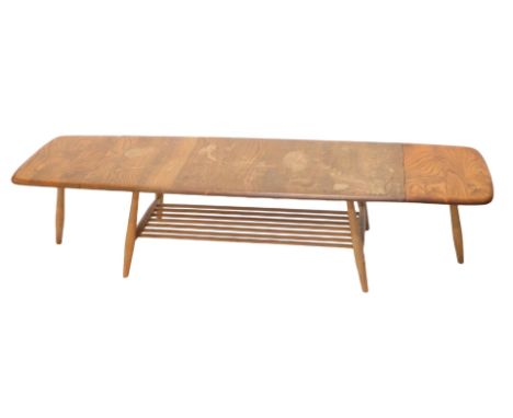 An Ercol elm rectangular drop leaf coffee table, on turned supports, 159cm wide overall. 