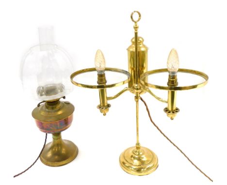 A brass oil lamp, with clear glass chimney, and a table lamp, lacking shades. (2)