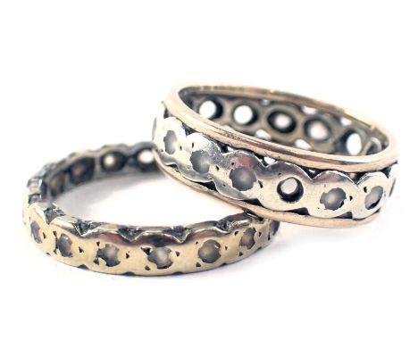 Two eternity rings, each stone set with CZ stones, yellow metal unmarked, ring size K½ and N, 4.8g all in. 