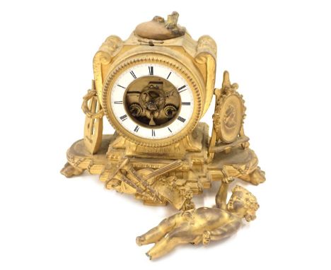 A 19thC gilt metal mantel clock, with exposed movement, a white enamel Roman numeric dial, and an attached cherub figure, 22c