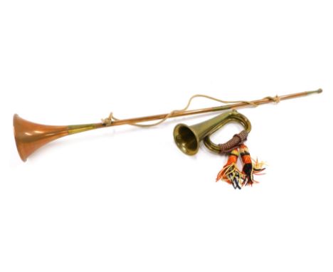 A brass bugle, and a copper and brass hunting horn. 
