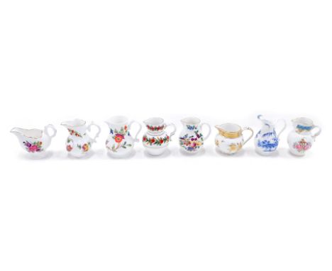 A collection of eight Royal Worcester historic porcelain jugs, with some paperwork.