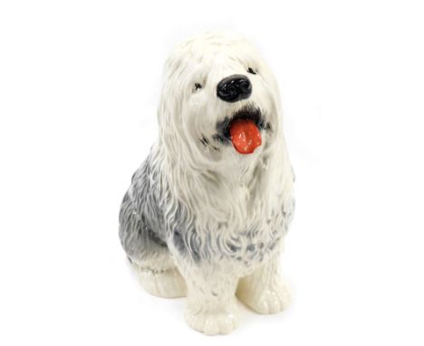 A Beswick ceramic model of an Old English sheepdog, impressed marks to underside, numbered 2232, 30cm high. (AF) 