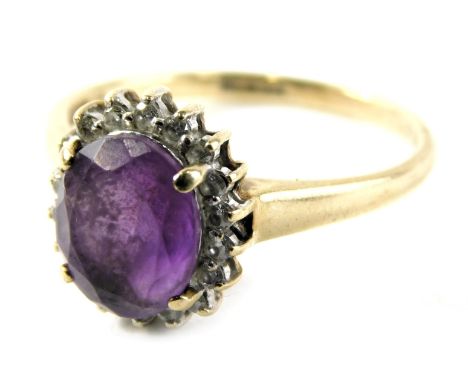 A 9ct gold dress ring, set with opal cut amethyst in four claw setting surrounded by CZs in a floral cluster, ring size S½, 3