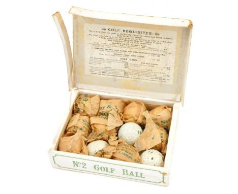 An unused set of late 19th/early 20thC Army and Navy Stores golf number 2 ball, with new markings, still boxed and with origi