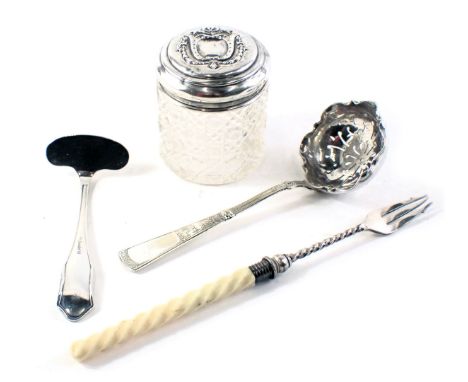 A silver topped and cut glass dressing table jar, silver plated sifter spoon, silver plated food pusher, and a bone and plate