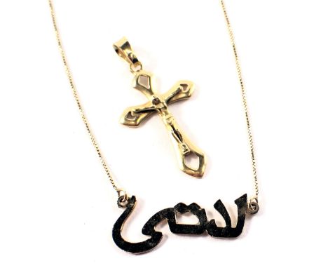 Two pendants and chains, comprising a crucifix pendant, yellow metal unmarked, and a Middle Eastern quote pendant and chain, 