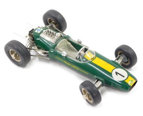 A Schuco 1071 model of a Lotus Climax 33 Formula 1 racing car, numbered 1 to the bonnet, and label for Arai to the rear, in o