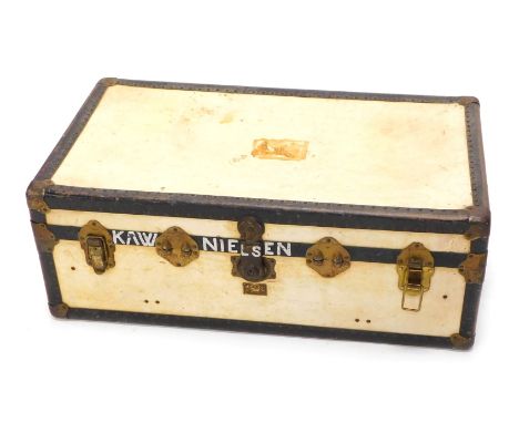 A velum and gilt coloured metal cabin trunk, with leather side handles, stencilled mark for KAW Nielsen, Hart House, 97cm wid