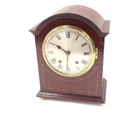 A 19thC mahogany cased mantel clock, with a silvered circular Roman numeric dial, twenty eight day movement with black hands,