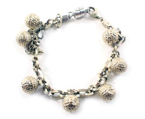 A ball design bracelet, the elongated oval links with seven ball drops, yellow metal stamped 375, with additional silver stai