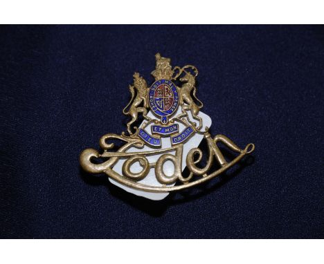 Scarce brass and enamel Foden cap badge 