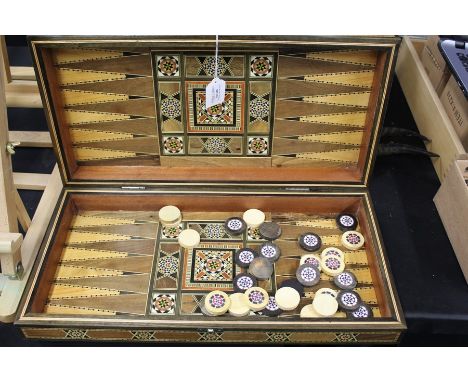 Persian games box, with an inlaid playing surface to the top games pieces inside and backgammon, the box 50cm wide