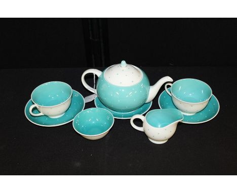 Susie Cooper tea set, consisting with a tea pot, cup and saucer, milk jug and sugar bowl