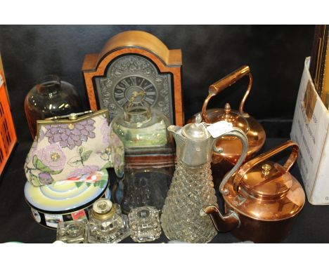 Works of art to include mantle clock, two copper kettles, two glass shades, three glass inkwells, claret jug, evening bag, ti