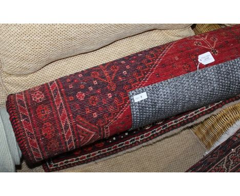 Middle Eastern carpet, the brick red ground with white and red diamond pattern centre surrounded by multiple borders, 148cm x