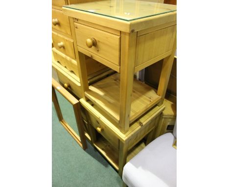 Pair of pine bedside/lamp tables, with plate glass tops above single frieze drawers, on square legs united by flattened under
