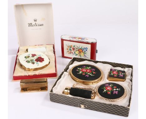 Assortment of vintage powder compacts and vintage beauty products including a musical "Dandy Mate" compact, a Stratton "Lipvi