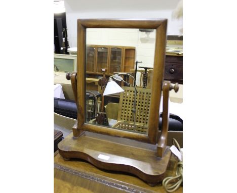 Mahogany dressing table mirror on a serpentine plinth base, reading lamp with feather decorated shade and scroll decorated st