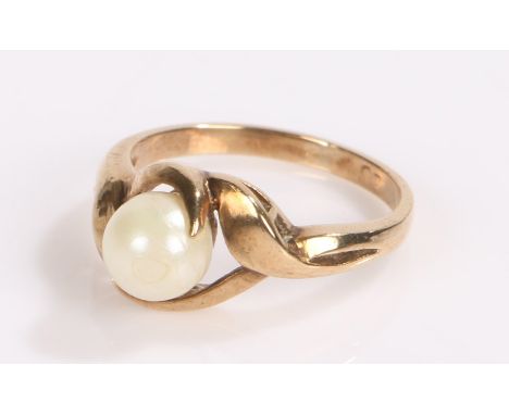 9 carat gold ring the twisting shoulders wrapping around a faux pearl, ring size K