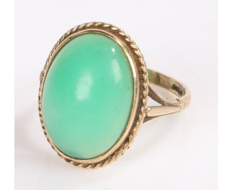 9 carat gold ring set with an oval green stone, ring size O