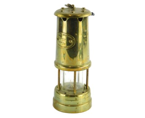 A Lamp and Lime light Company Hockley brass miners lamp, the plaque stating colliery number 8721 serial number 6107, 22cm hig