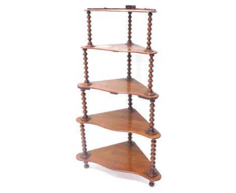 A Victorian walnut five tier whatnot, on bobbin turned supports, 113cm high, 65cm wide.