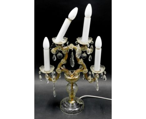 A continental glass four branch light fitting, decorated with various moulded glass flowers and droplets, 44cm high.