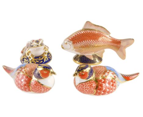 A collection of four Royal Crown Derby porcelain paperweights, two pheasants, frog, and a fish, lacking stoppers. (4)