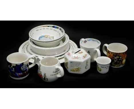 A collection of Wedgwood Peter Rabbit child's dinner wares, to include plate, bowl, loving cup, egg cup, a money bank, a Wedg