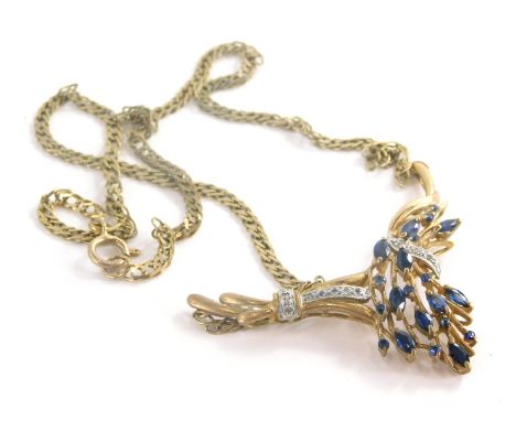 An Eastern style pendant and chain, the arched pendant set with oval cut sapphires, and tiny cz stones on a bracket chain, th