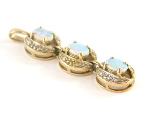 A 9ct gold opal and diamond pendant, with three link pendant with oval opal and outer borders of tiny diamonds, the pendant 4