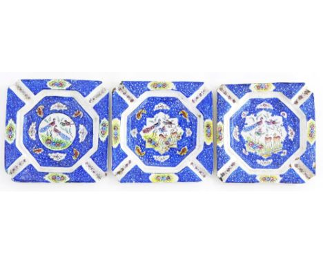 A set of three enamel hand painted ash trays, decorated with bird's, deer, flowers, etc., 10cm wide.