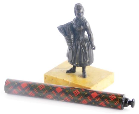 A 19thC bronze match holder in the form of a lady carrying hay, on a square marble base, 11cm high, and a 19thC tartan ware p