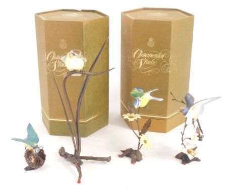 A collection of four Royal Worcester porcelain ornamental studio figures of birds, to include Swallow, Blue Tit, etc., each s