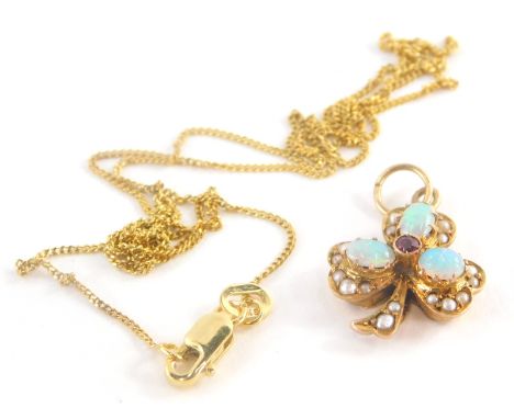 An opal, seed pearl and ruby set clover pendant and chain, the clover pendant with central ruby surrounded by three opals and