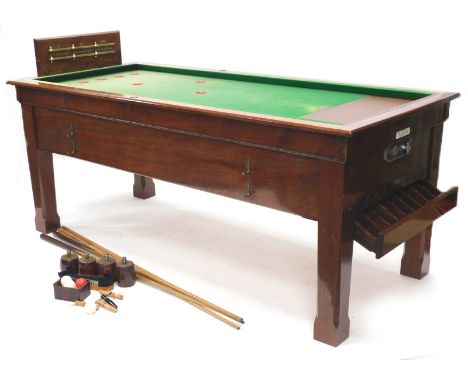 A Sams Brothers Limited mahogany coin operated bar billiards table, with various cues, etc.