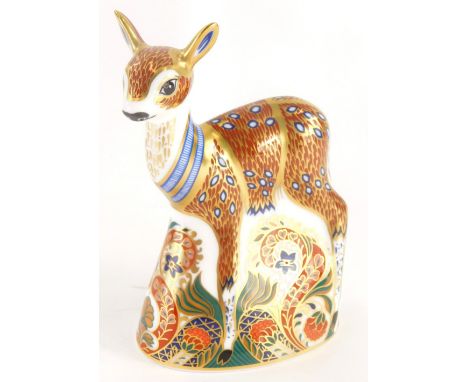 A Royal Crown Derby porcelain fawn paperweight, with silvered stopper, stamped in red to underside an exclusive for the Royal