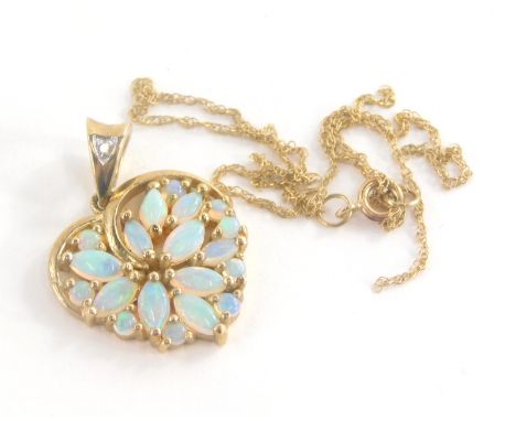 An opal and diamond set heart shaped pendant, in yellow metal mount marked 375, 2cm high, together with a fine link chain (AF