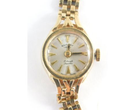 A Rotary 9ct gold ladies wristwatch, with small silver coloured circular dial, 1.2cm wide, on a three row 9ct gold bracelet, 