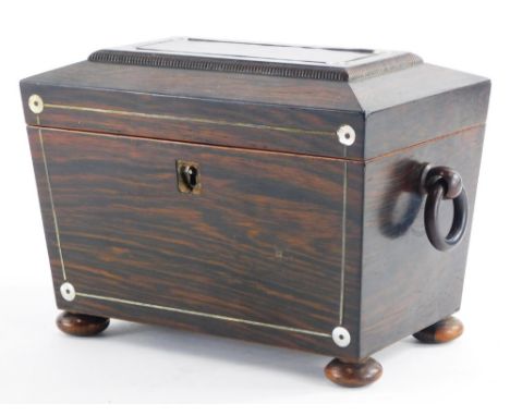 An early Victorian rosewood pewter strung and mother of pearl inlaid sarcophagus shaped tea caddy, the hinged lid enclosing t