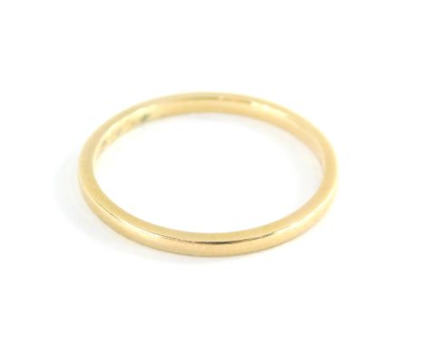 An 18ct gold thin wedding band, ring size R, 2g.