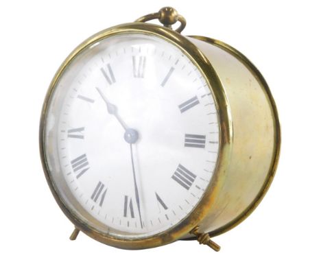 A late 19thC French carriage timepiece, with circular enamel dial, loop handle and turned feet, 9.5cm diameter.