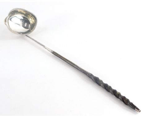 A 19thC ladle, with a silver coloured metal bowl and a beaded rim, initialled to handle R.C, marks indistinct to bottom of bo